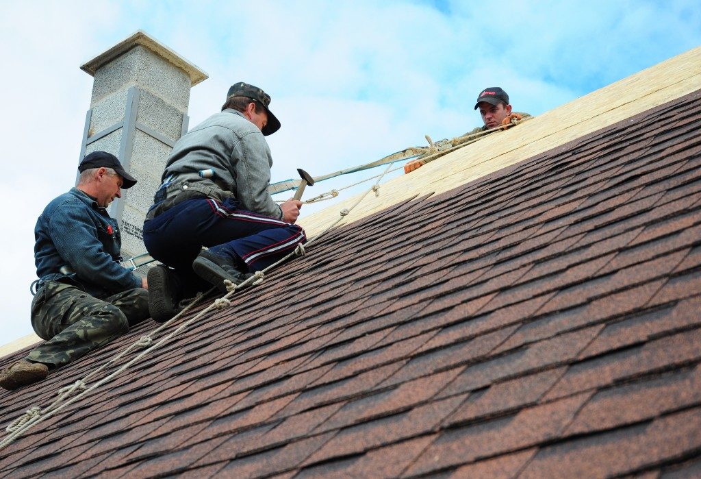 Roofing contractors installing new roof