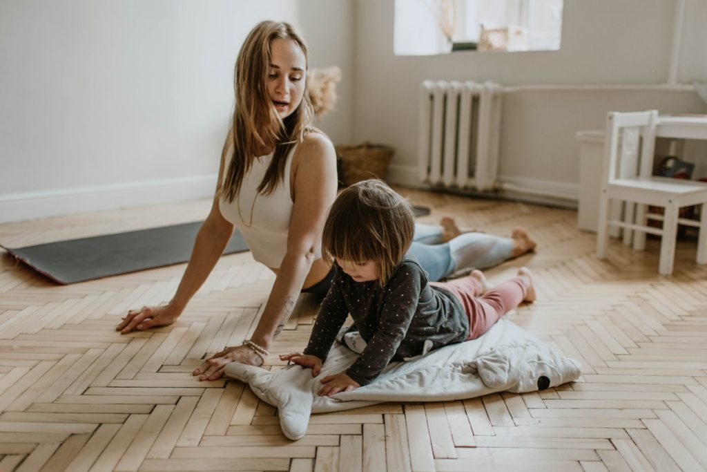 Mom doing yoga with child