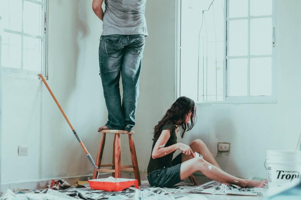 couple painting their house