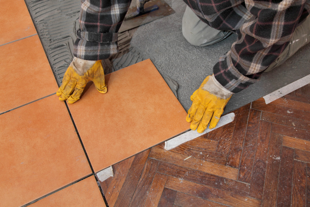 man preparing tiles
