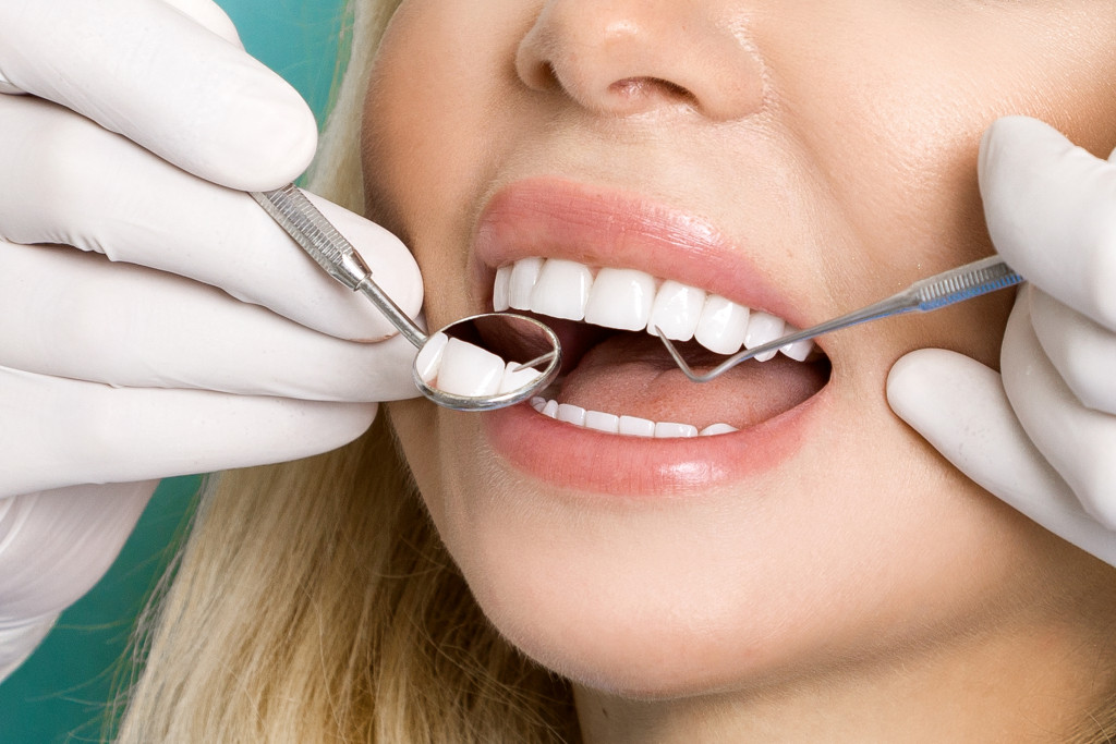 A woman with good teeth getting a dental checkup
