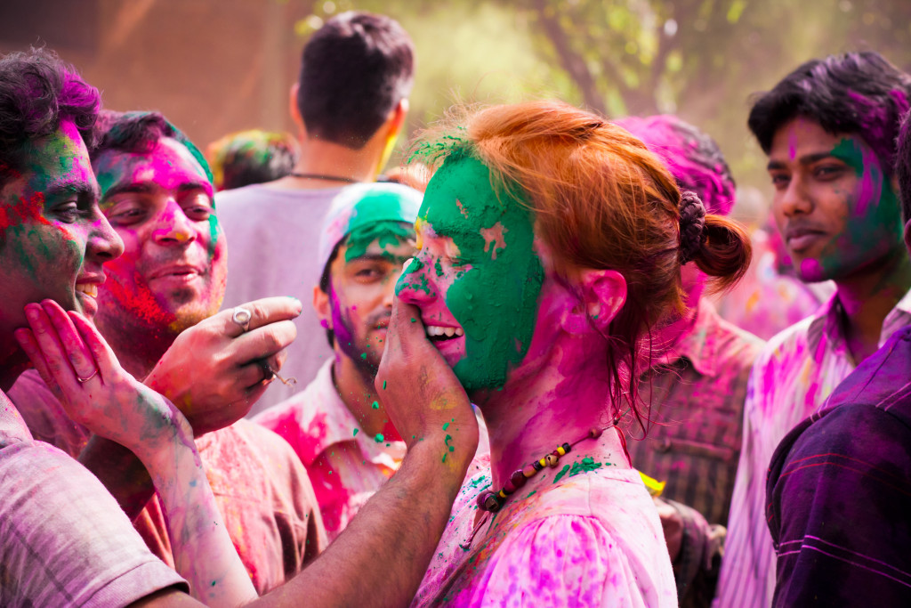 Tourist with students of Jawaharlal Nehru University celebrate festival Holi