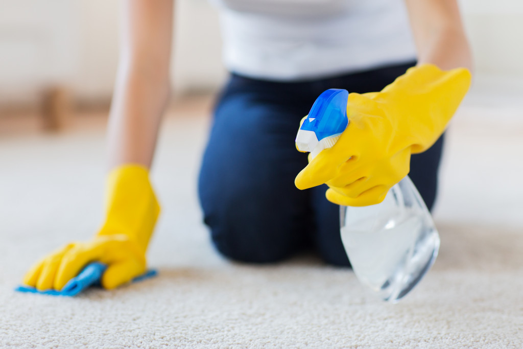 A woman cleaning the floor