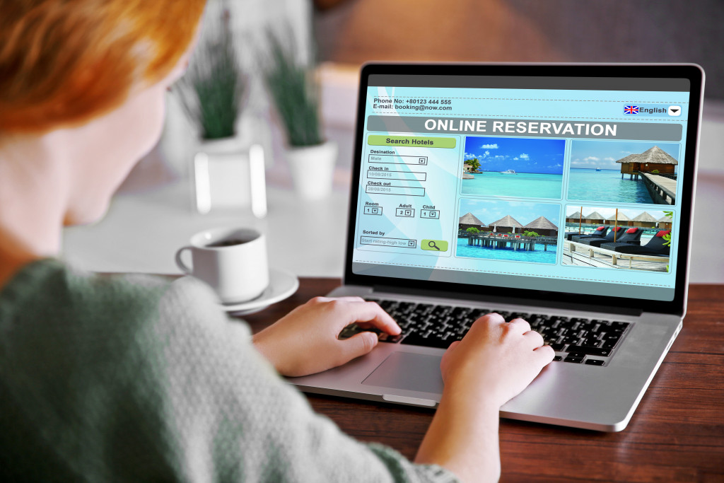woman reserving accommodations online