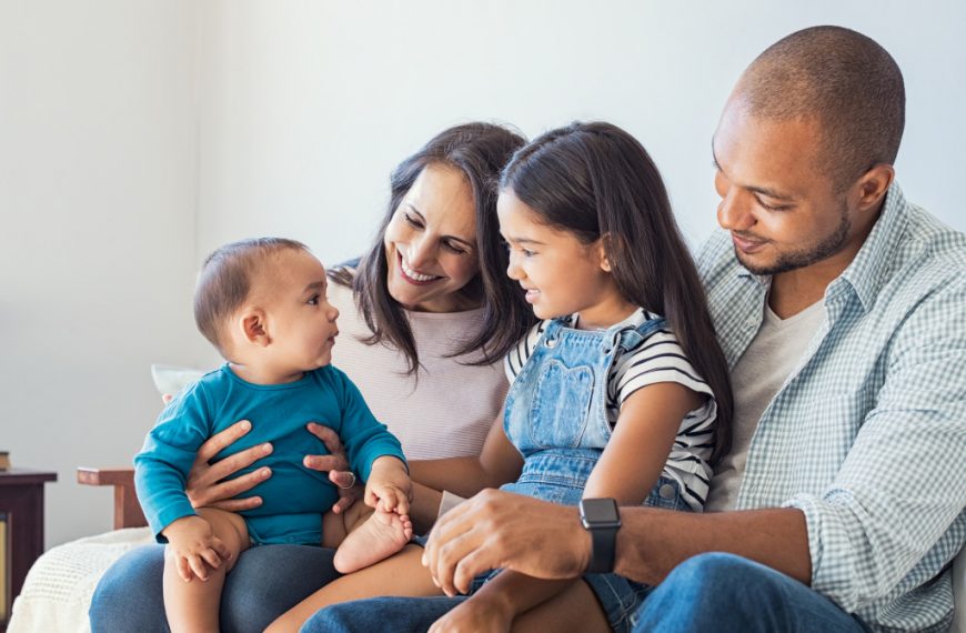 happy family in sofa with baby boy