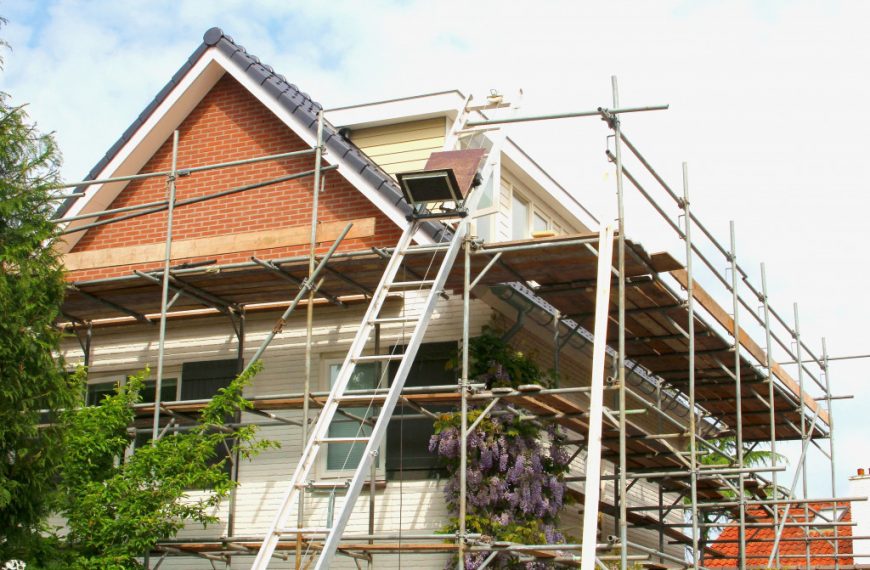 A home being renovated with scaffolding on the exteriors