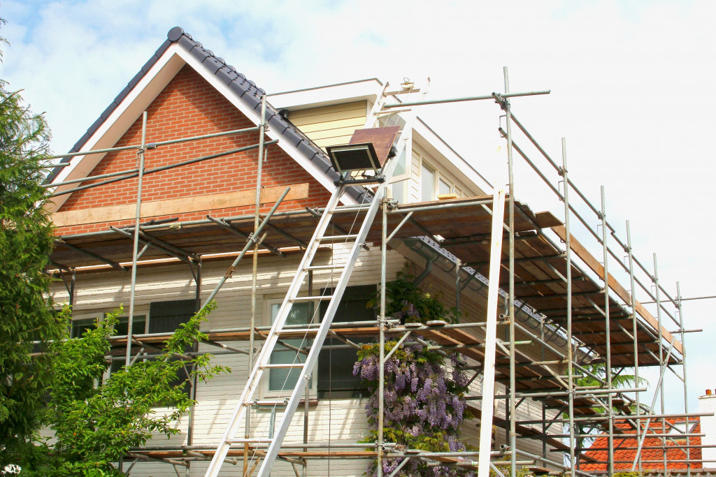 A home being renovated with scaffolding on the exteriors