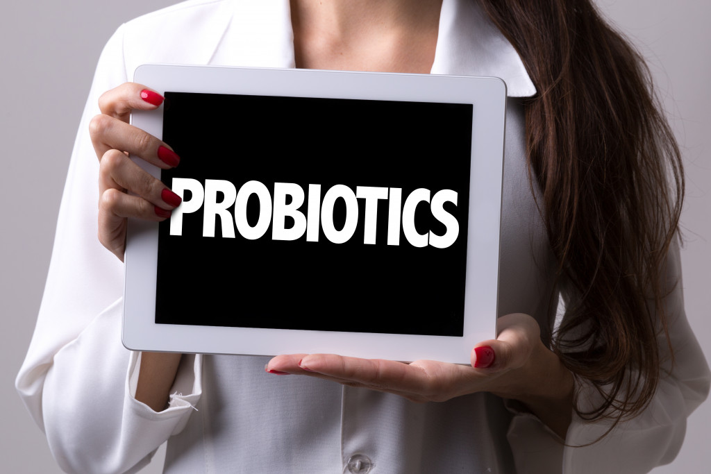 doctor holding tablet with probiotics word