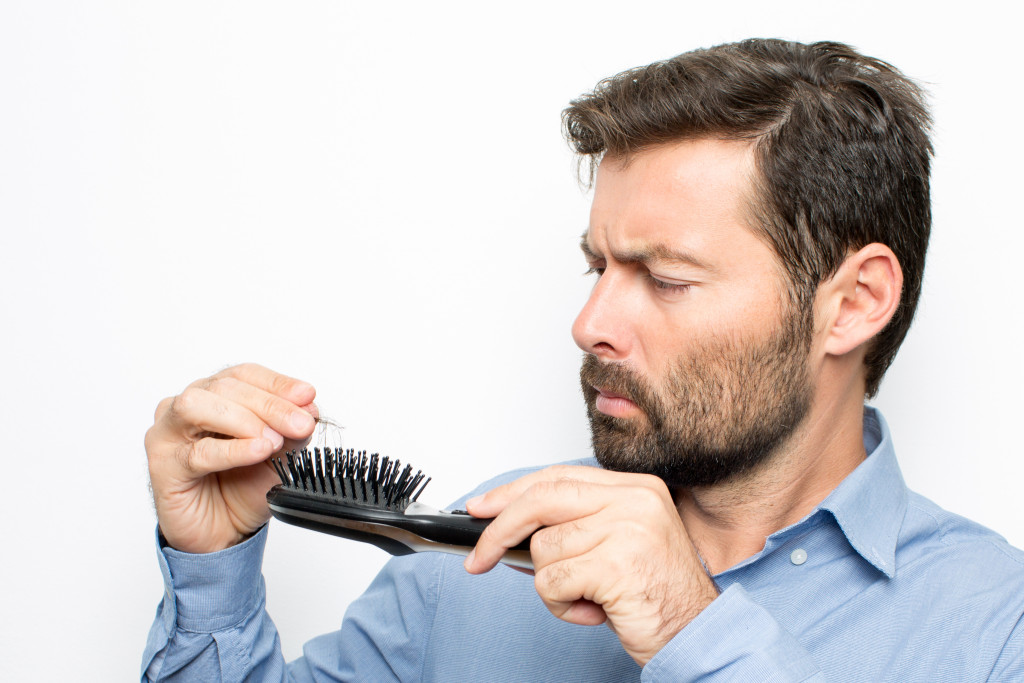 manwith hair loss finding hair in his brush