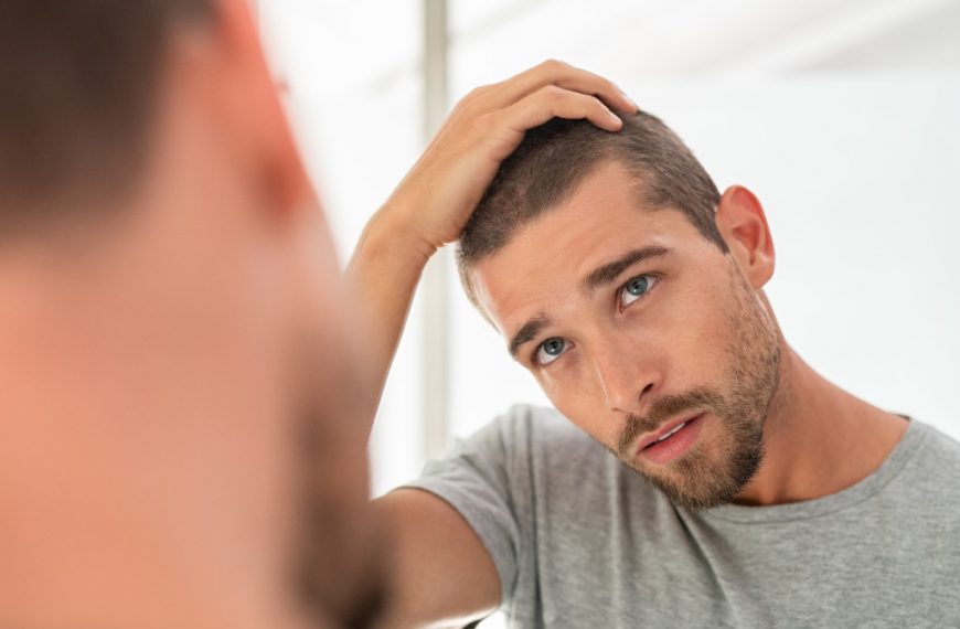 man looking at the mirror