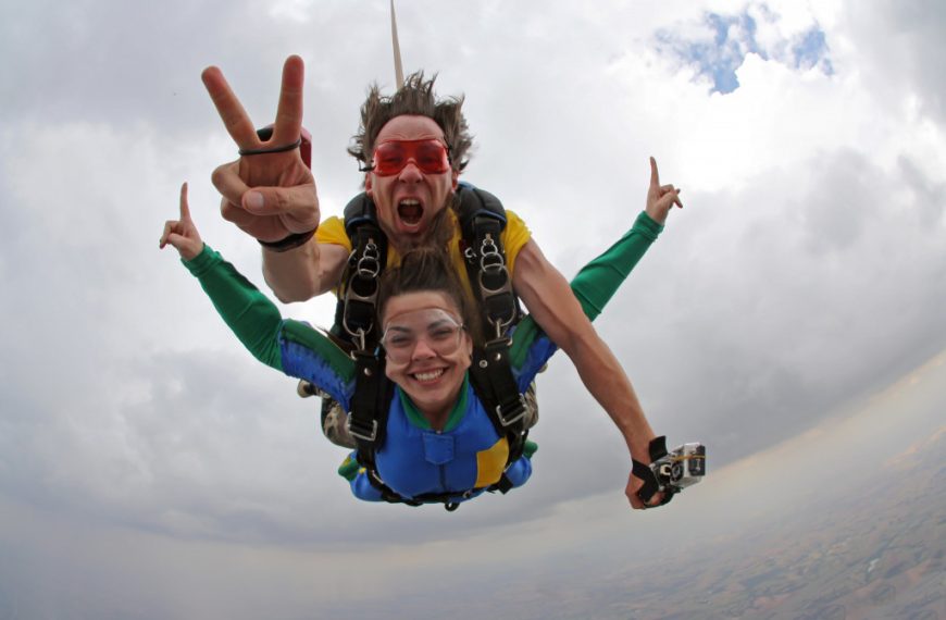 Skydiving instructor with a female client.