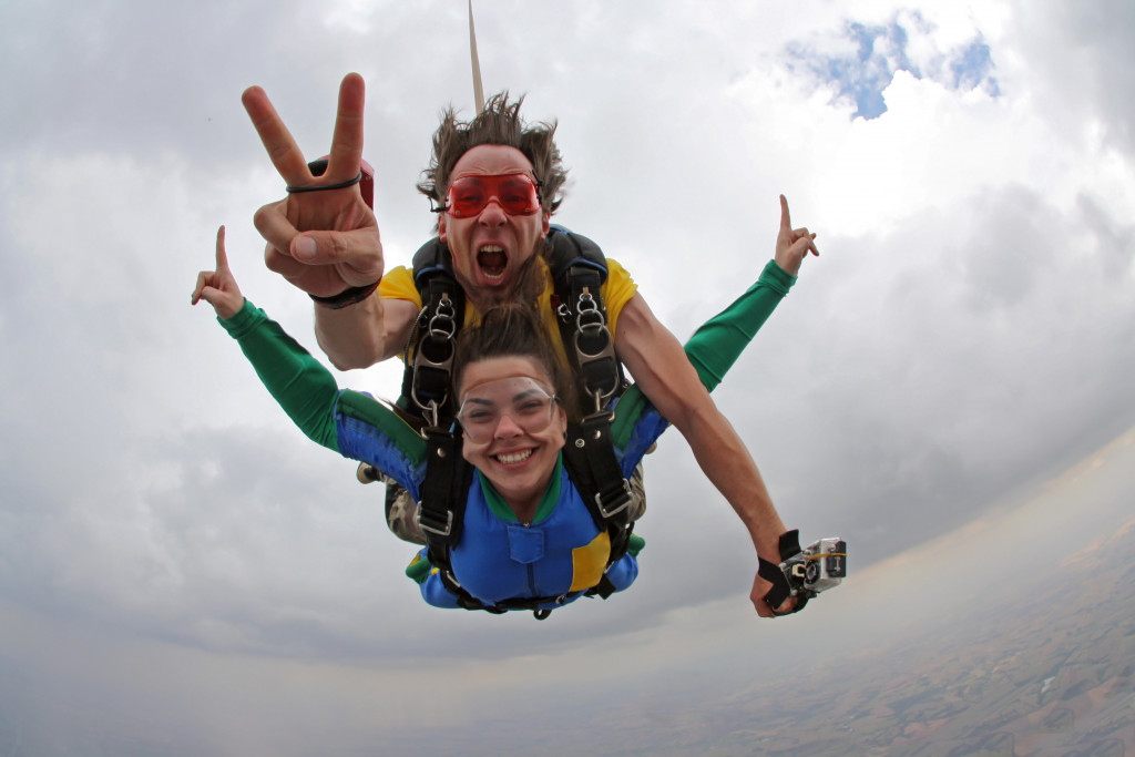 Skydiving instructor with a female client.