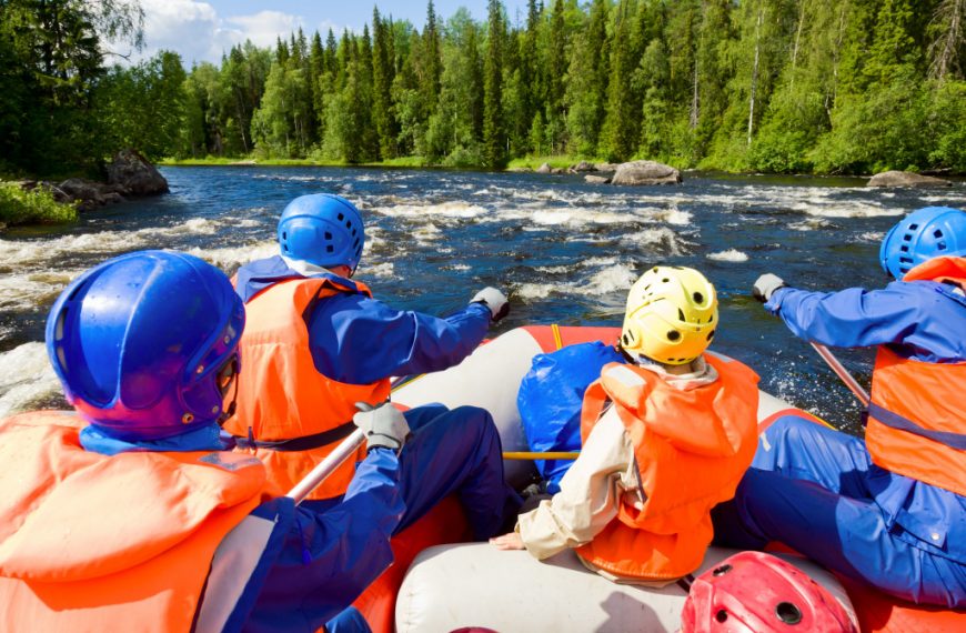 people in an outdoor adventure kayaking