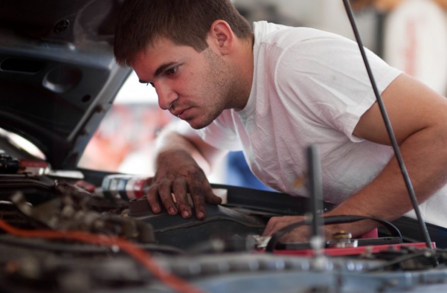 Man working on car in garage