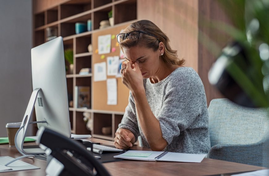 stressed female worker in office