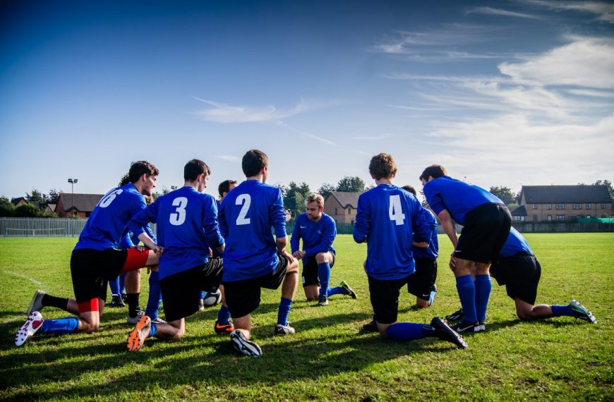 Group of Sports Player Kneeling on Field