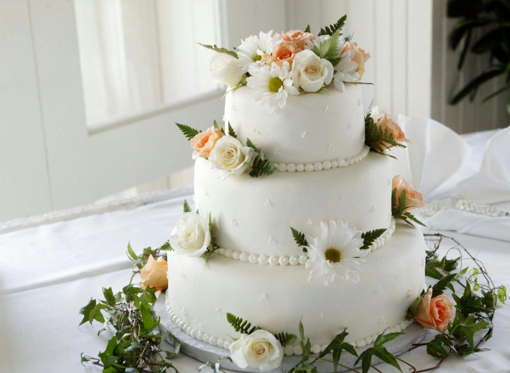 White wedding cake with floral decor